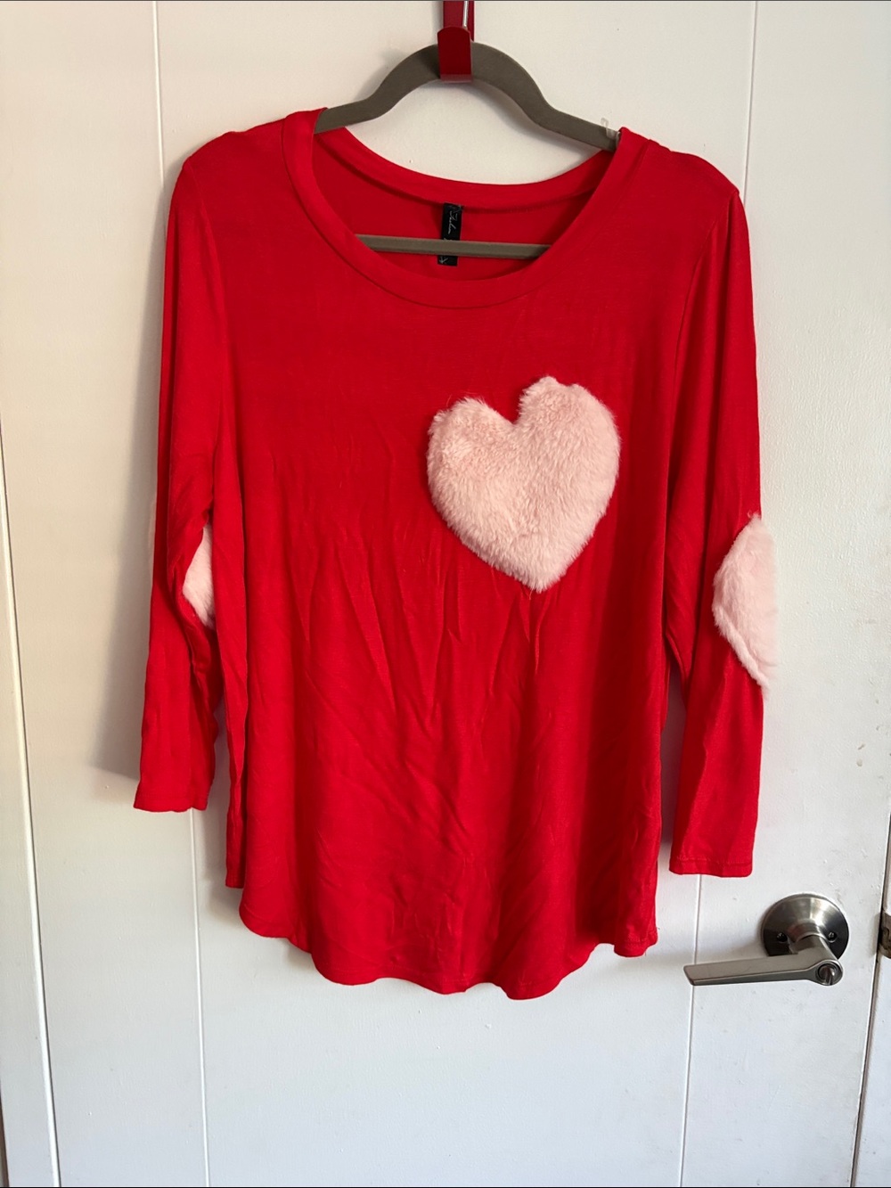 Red long sleeve top with white fuzzy hearts